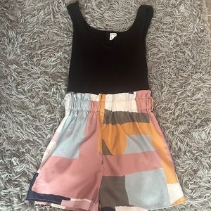 Romper, black with a bunch of other colors, extremely comfortable and cute.